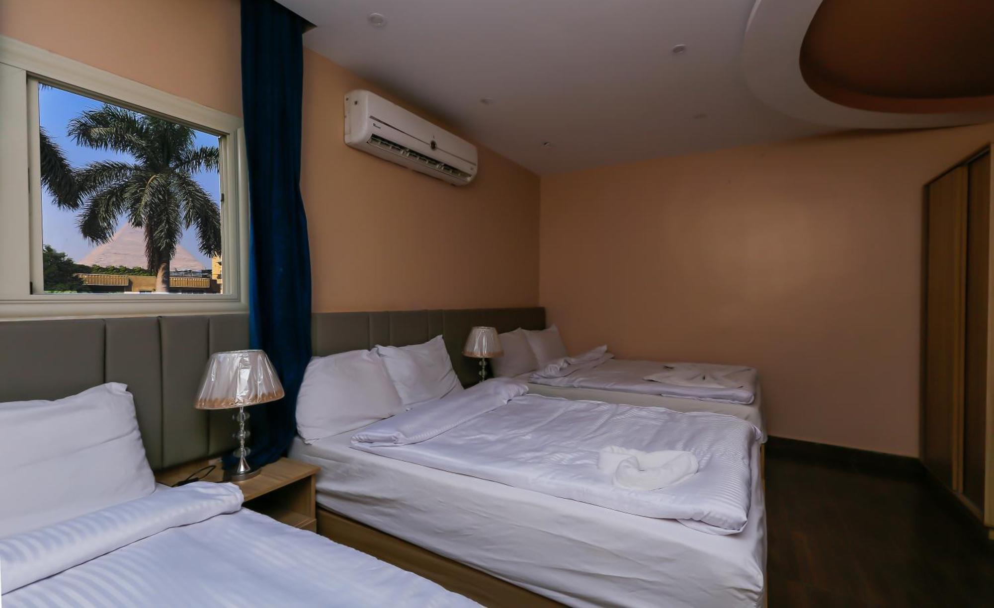 Pyramids Express View Hotel Kafret el-Gabal Extérieur photo